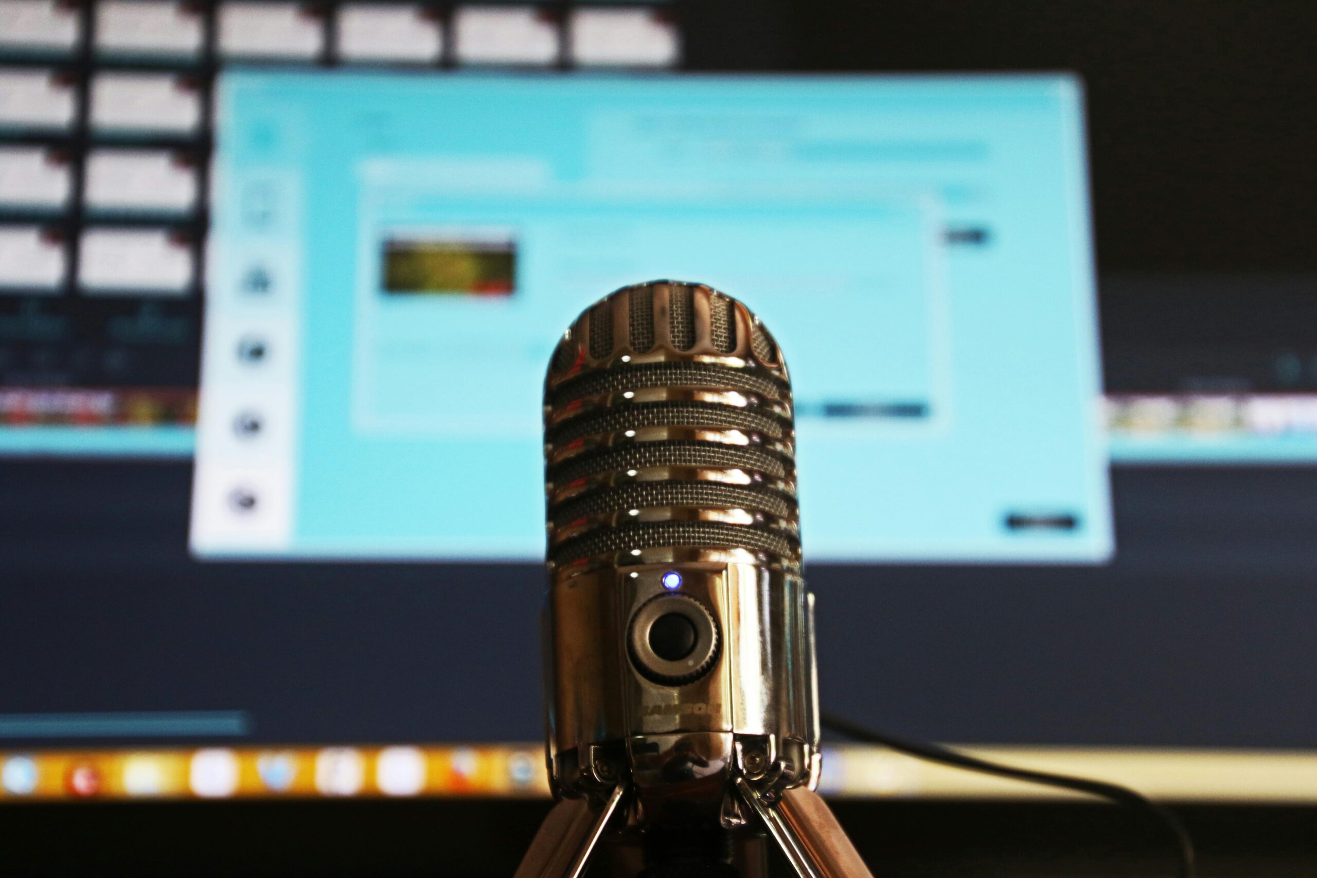 Image of a microphone and computer screen.